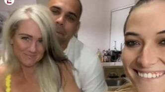 a woman and two men are taking a selfie