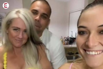 a woman and two men are taking a selfie
